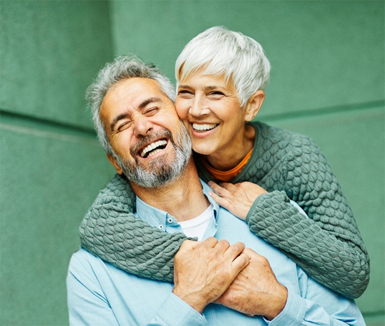 smiling older woman at the dentist office