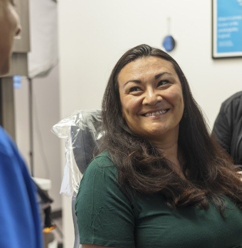 woman in dental chair smiling